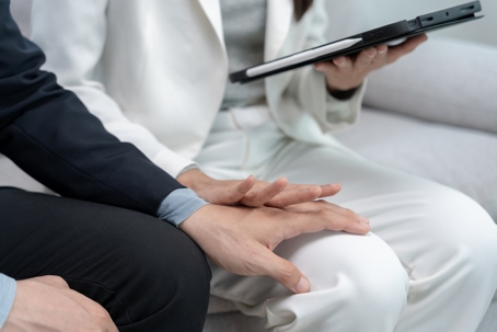 man touching woman inappropriately in the workplace